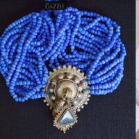 Multilayered pony glass beaded necklace with vintage afghani pendant